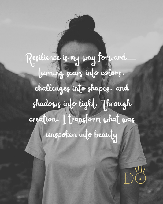Back view of Dorothée Rodriguez Velar standing in front of mountains, symbolizing resilience, transformation, and creativity.