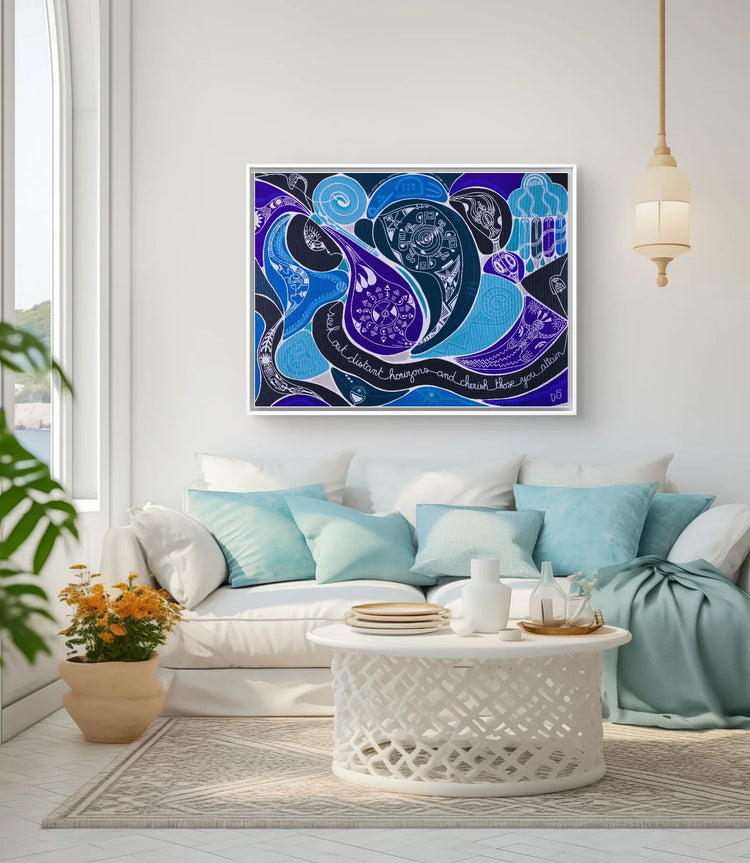 Large abstract blue and purple artwork displayed above a white sofa in a bright living room with turquoise cushions and a round carved coffee table.